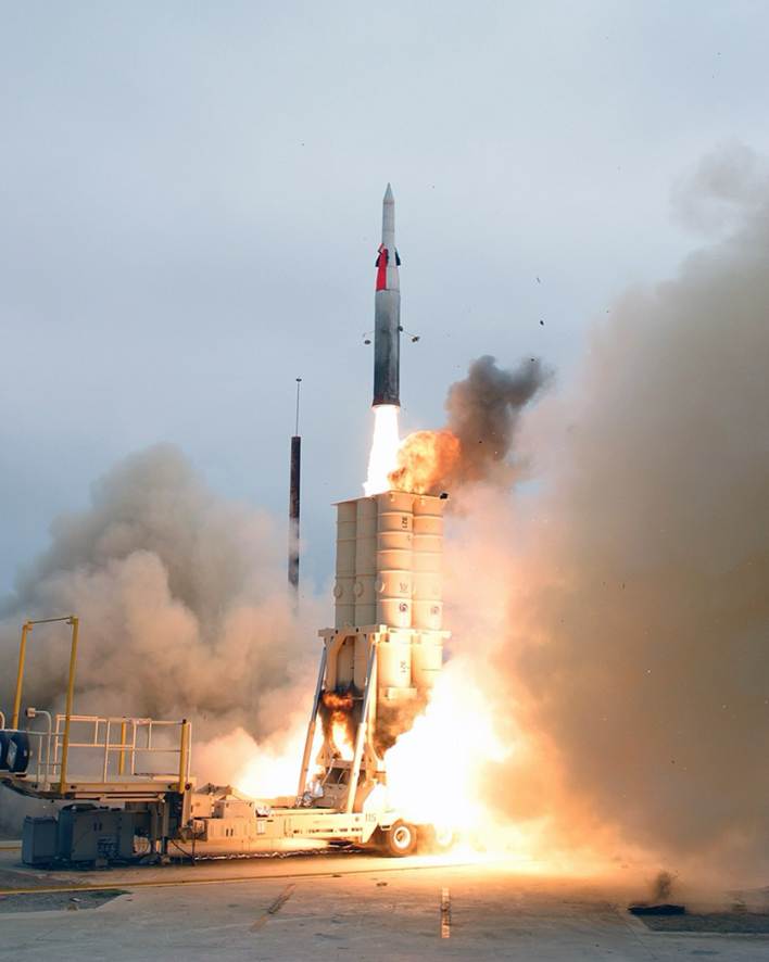 A rocket launching with smoke and flames
AI-generated content may be incorrect.